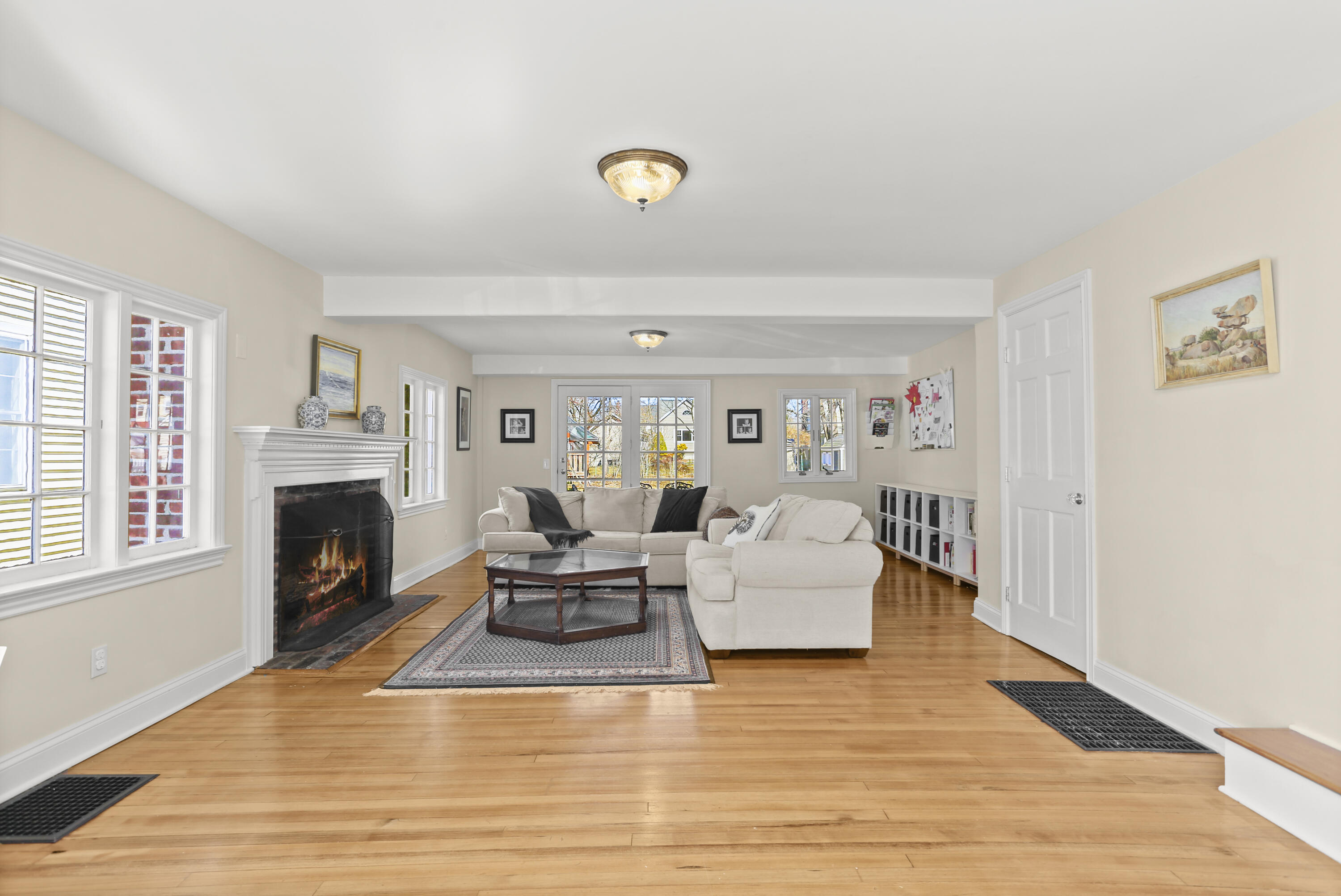5 Hazel Street Norwalk, CT 06851 - Photo 6 of 32 a living room with furniture a fireplace and a wooden floor