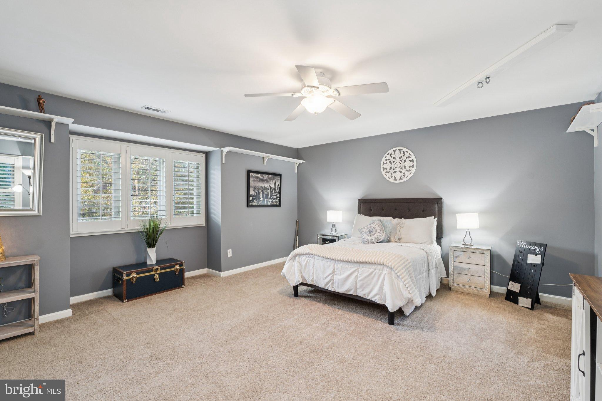 47660 Pennrun Way Sterling, VA 20165 - Photo 17 of 55 a bedroom with a bed and a chandelier