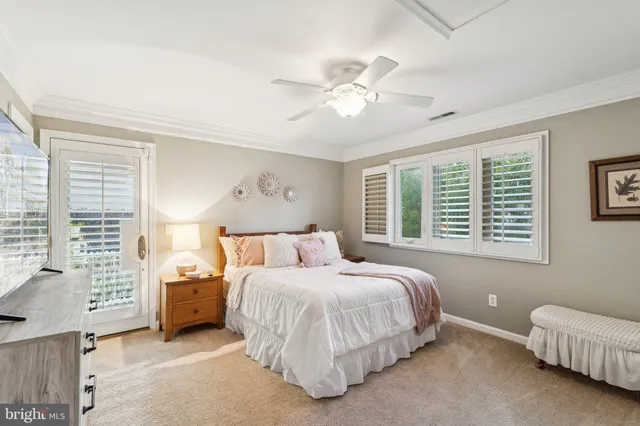 a bedroom with a bed and a chair