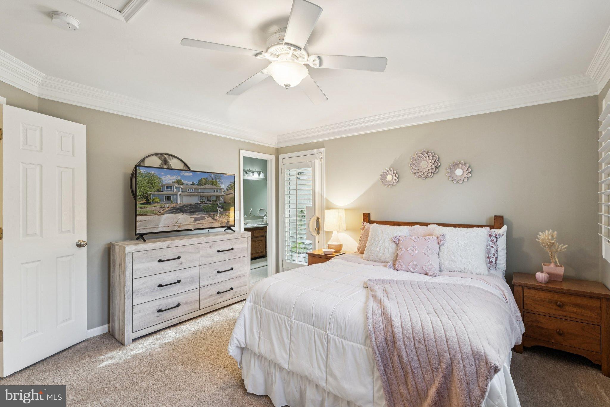 47660 Pennrun Way Sterling, VA 20165 - Photo 19 of 55 a bedroom with a bed and a tv on the dresser