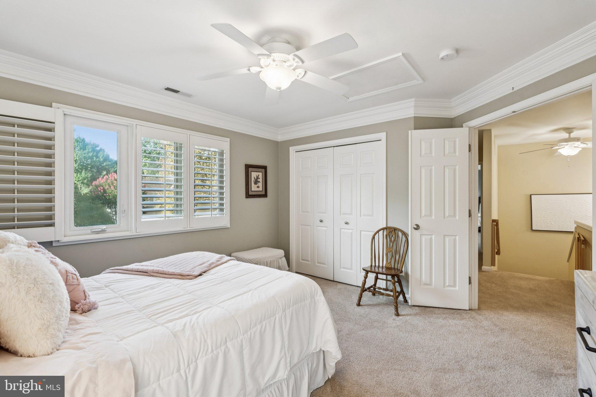 47660 Pennrun Way Sterling, VA 20165 - Photo 20 of 55 a bedroom with a bed and a chair