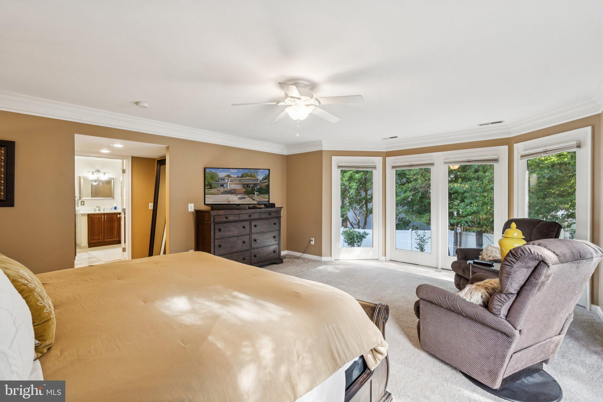47660 Pennrun Way Sterling, VA 20165 - Photo 26 of 55 a spacious bedroom with a large bed and a large window