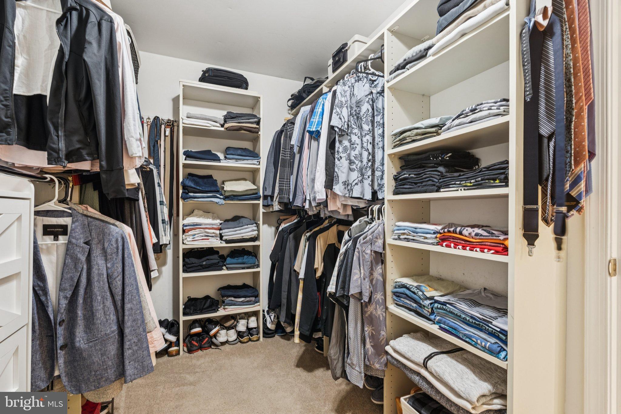 47660 Pennrun Way Sterling, VA 20165 - Photo 29 of 55 a view of walk in closet with clothes and shoes