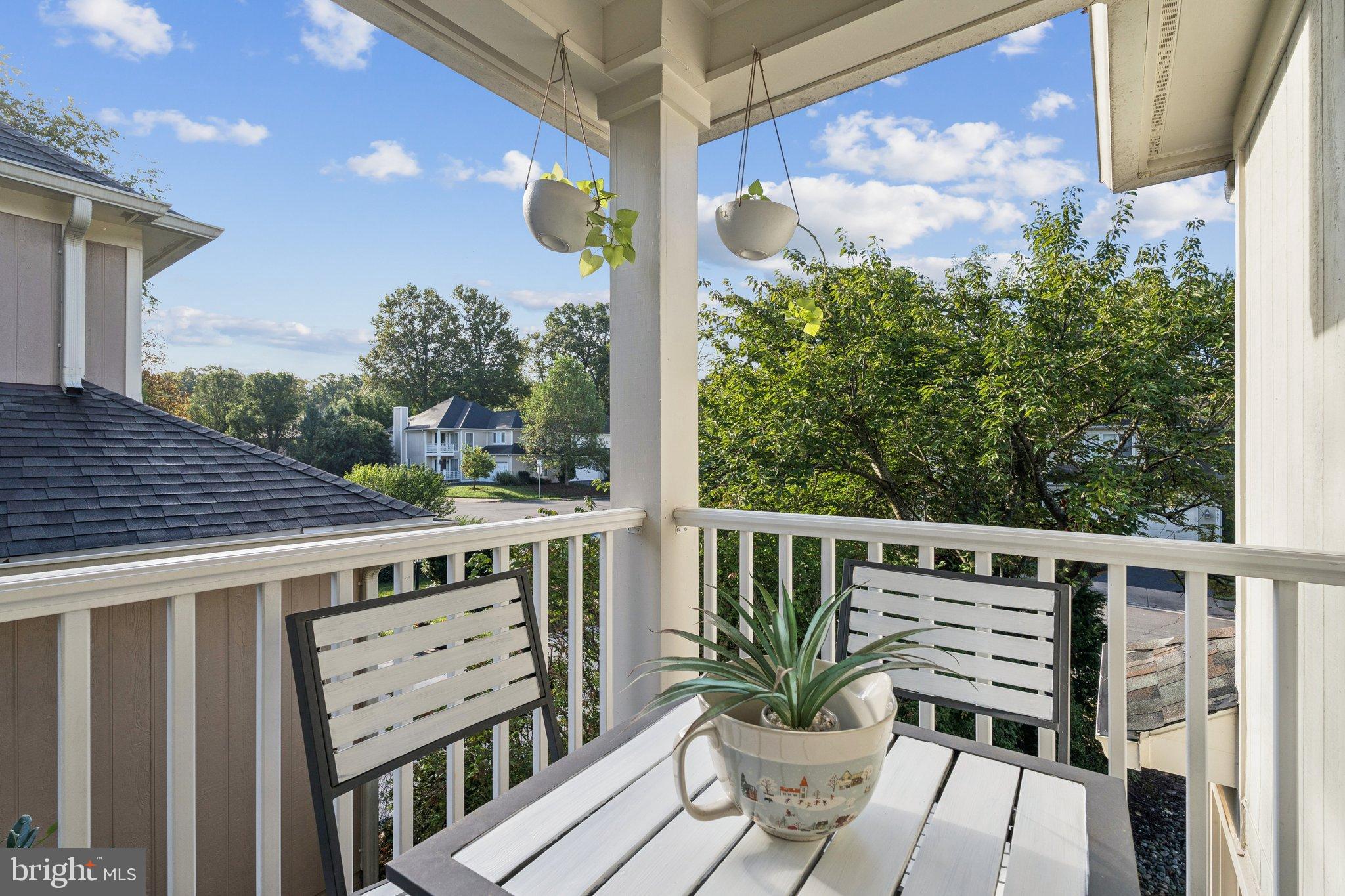 47660 Pennrun Way Sterling, VA 20165 - Photo 30 of 55 a view of balcony with wooden floor and seating space