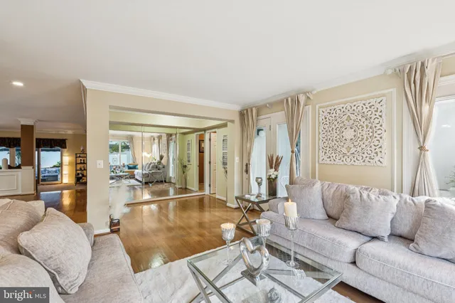 a dining room with furniture and wooden floor