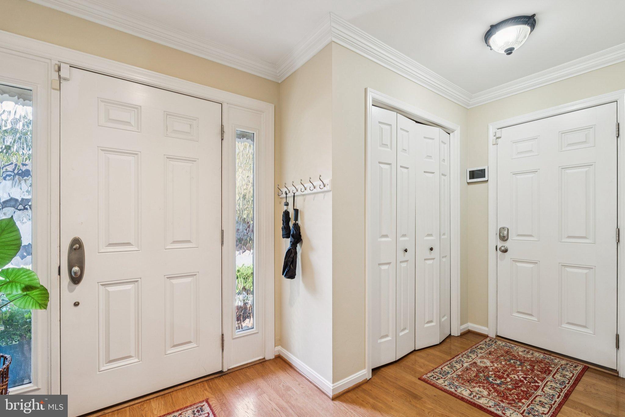 47660 Pennrun Way Sterling, VA 20165 - Photo 35 of 55 a view of a hallway with wooden floor and closet area