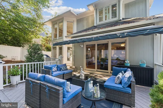 a patio with a patio table and chairs
