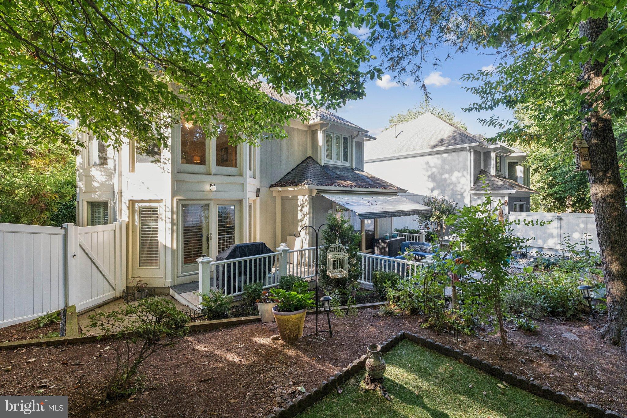 47660 Pennrun Way Sterling, VA 20165 - Photo 48 of 55 a view of a house with a yard and potted plants