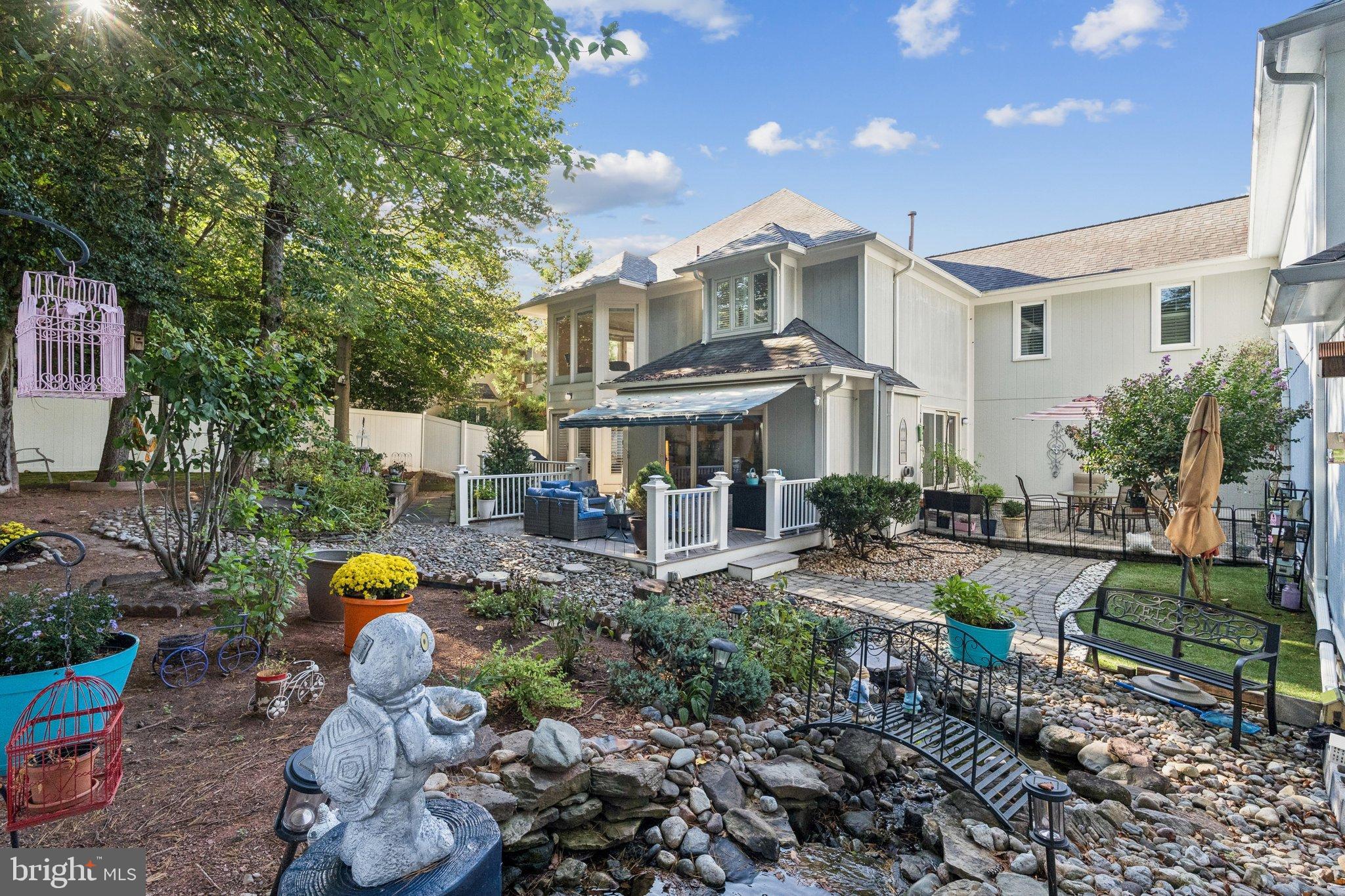 47660 Pennrun Way Sterling, VA 20165 - Photo 49 of 55 a front view of a house with yard and sitting area