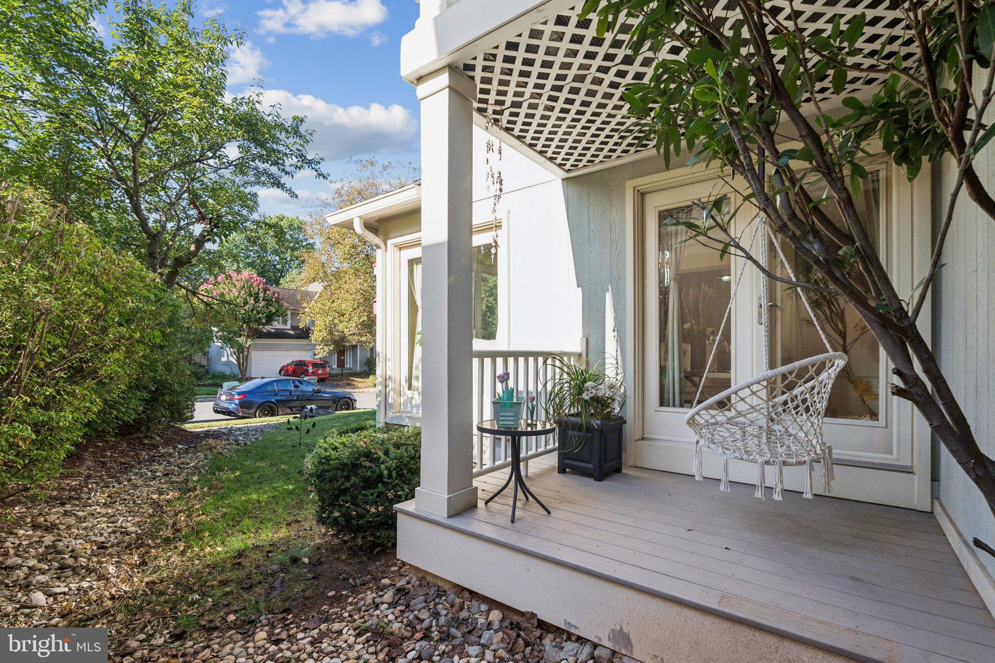 47660 Pennrun Way Sterling, VA 20165 - Photo 55 of 55 a view of a patio with table and chairs and potted plants