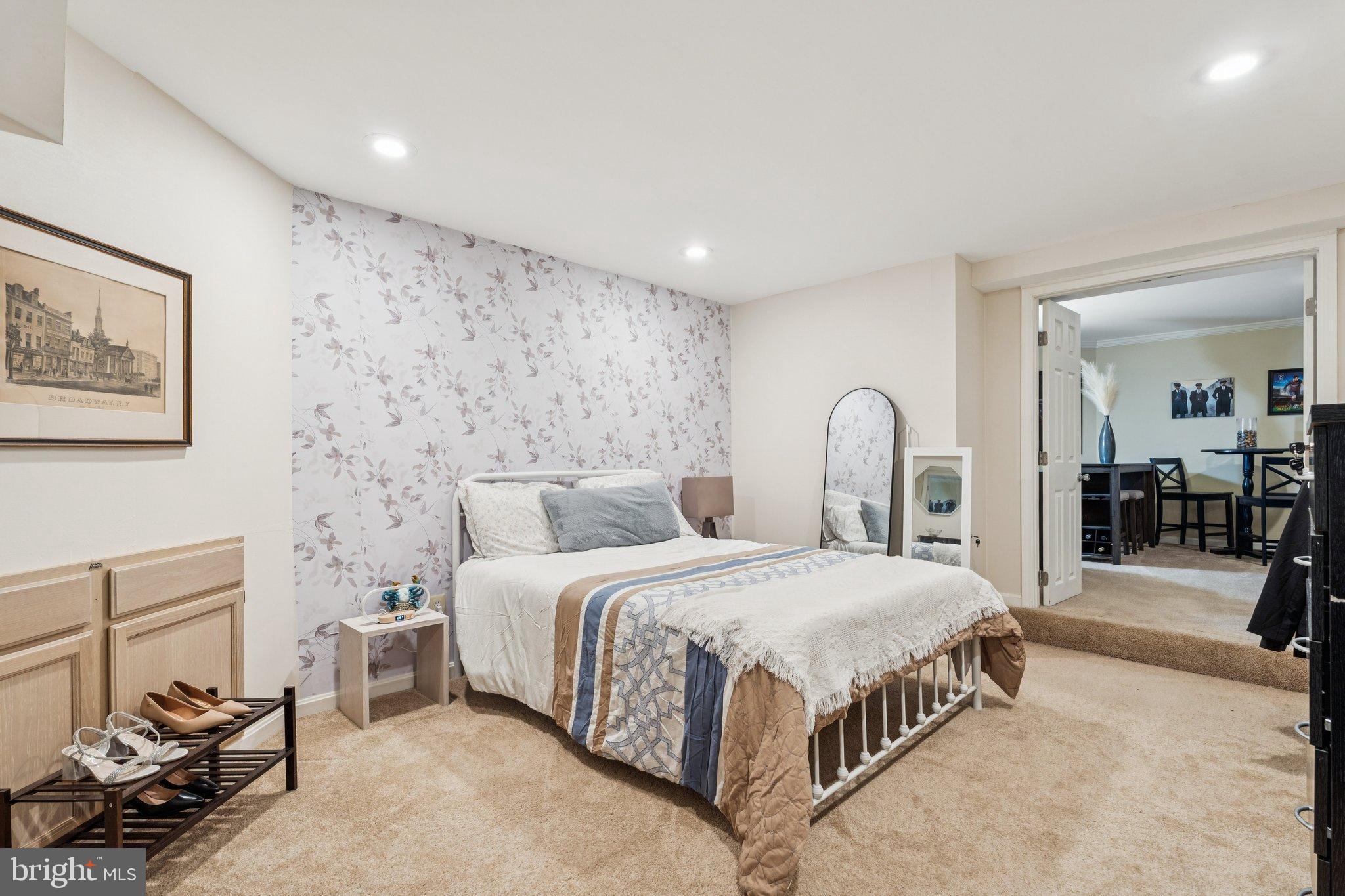 47660 Pennrun Way Sterling, VA 20165 - Photo 8 of 55 Serene bedroom with floral accent wall.