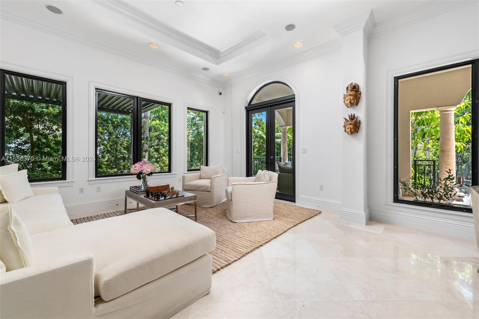 250 Buttonwood Drive Key Biscayne, FL 33149 - Photo 11 of 39 a living room with furniture and large windows