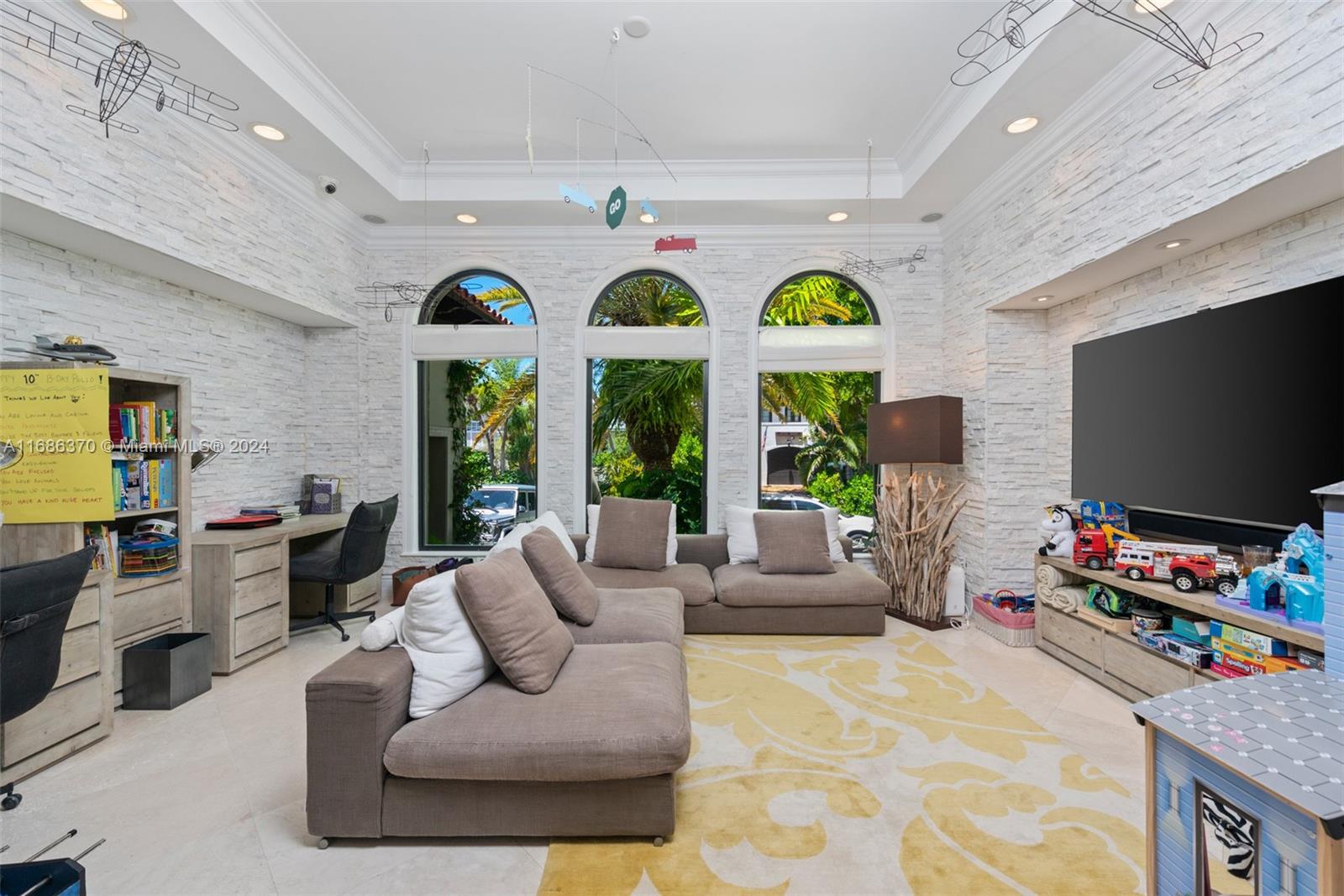 250 Buttonwood Drive Key Biscayne, FL 33149 - Photo 12 of 39 a living room with furniture and a large window