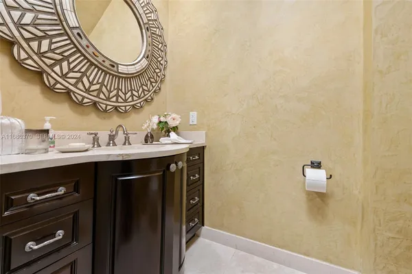 a bathroom with a sink a mirror and a toilet