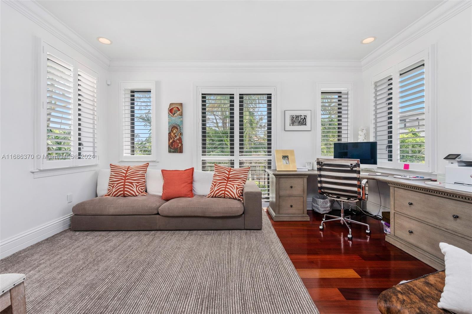 250 Buttonwood Drive Key Biscayne, FL 33149 - Photo 18 of 39 a living room with furniture and large windows