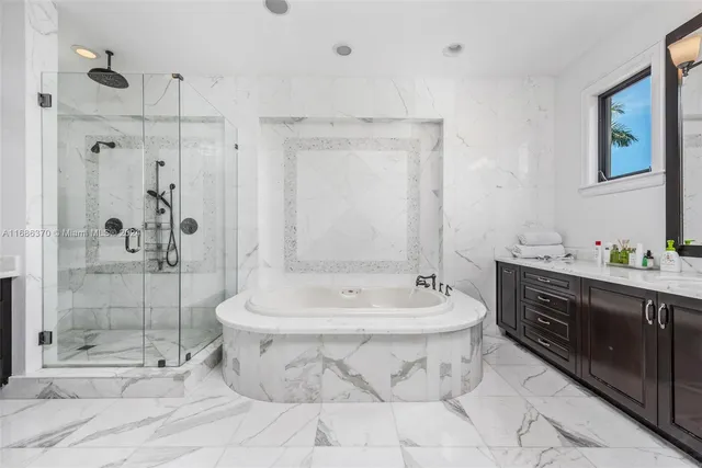 a spacious bathroom with a shower sink and mirror
