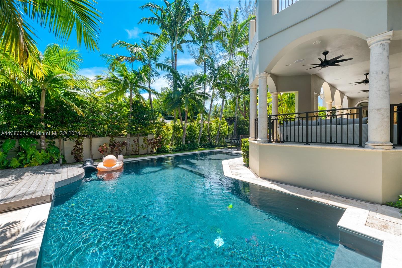 250 Buttonwood Drive Key Biscayne, FL 33149 - Photo 35 of 39 a view of a backyard with swimming pool