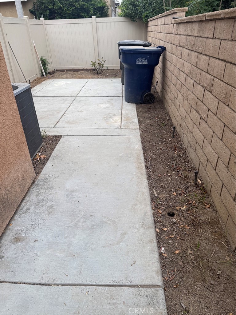 4420 Kristen Court Riverside, CA 92501 - Photo 36 of 39 WALKWAY FROM KITCHEN SLIDER TO BACKYARD AREA