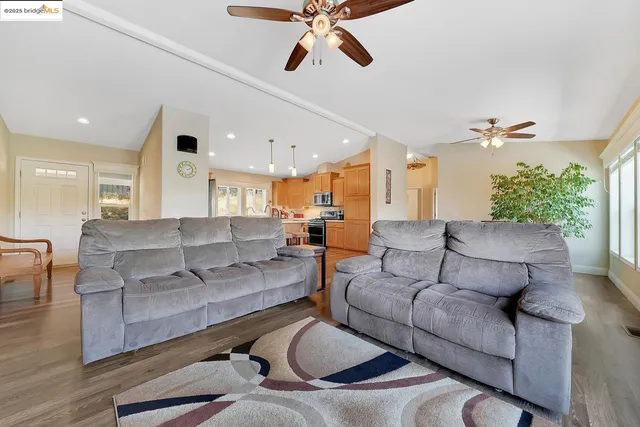 a living room with fireplace furniture and a flat screen tv