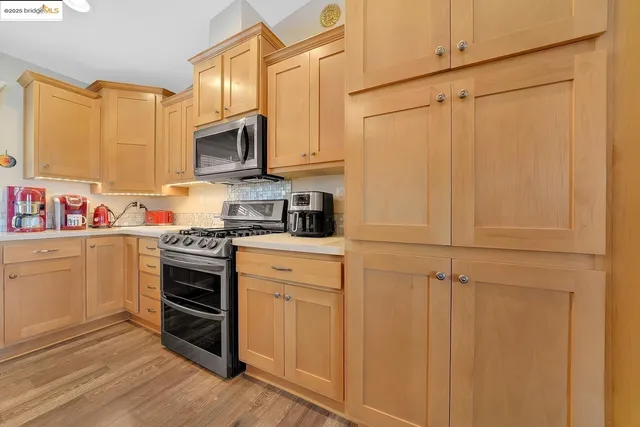 a kitchen with a stove and a microwave