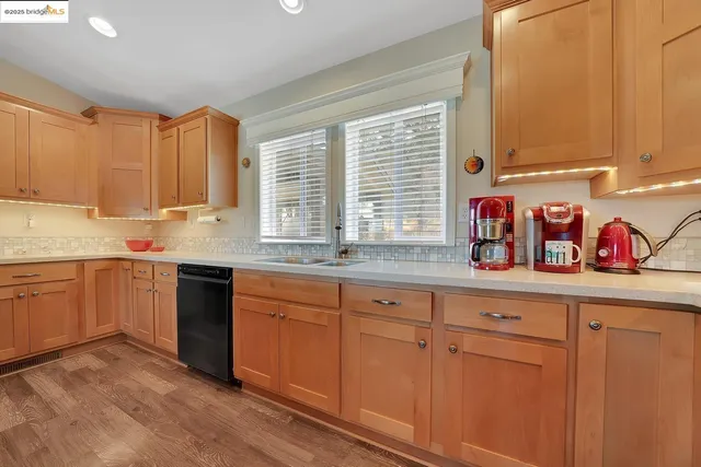 a kitchen with stainless steel appliances granite countertop a stove and a microwave