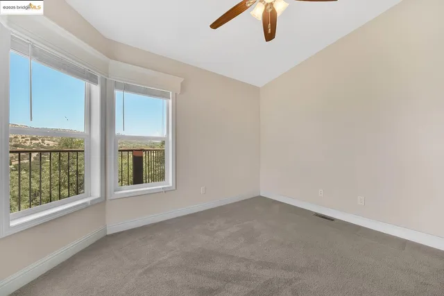 a bedroom with bed and a tv