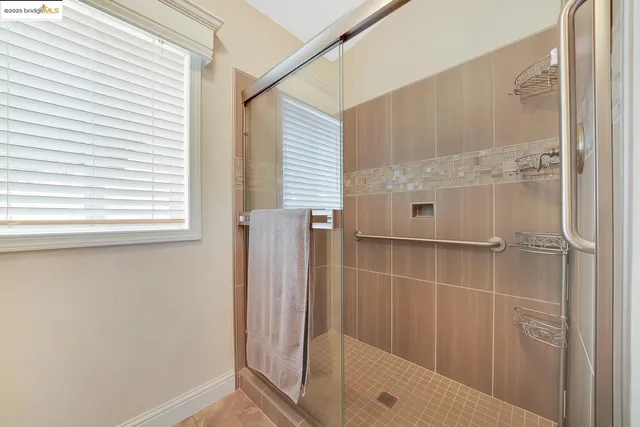 a view of a house with a yard and roof deck