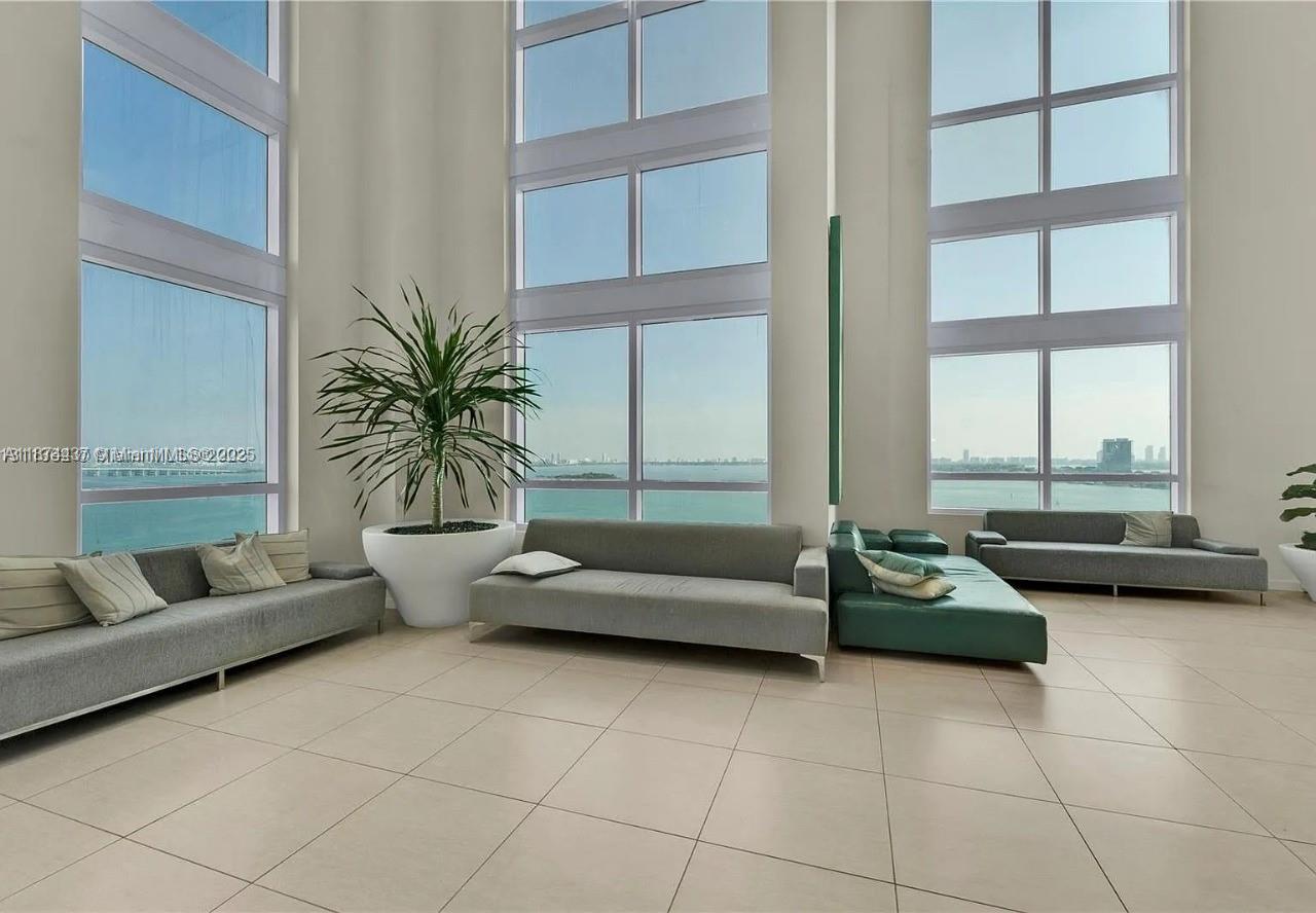 1900 North Bayshore Drive, Unit 3507 Miami, FL 33132 - Photo 18 of 22 a living room with furniture and a potted plant