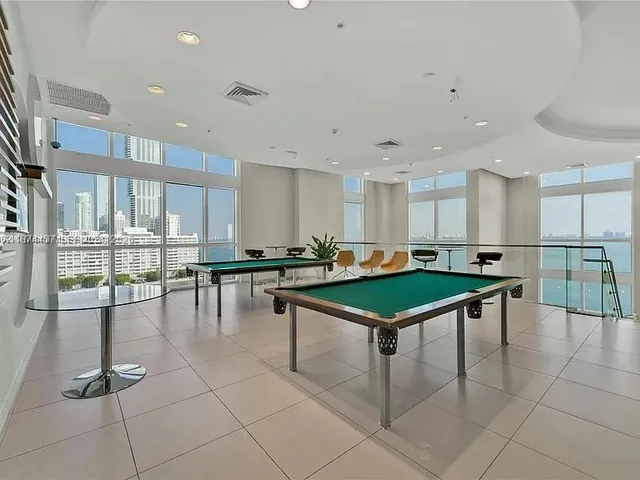 a room with lots of furniture and a table