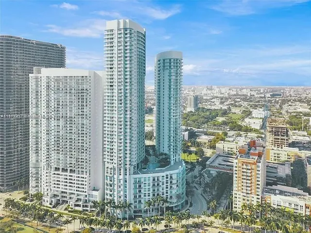 a view of a city with tall buildings