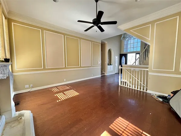 a view of a livingroom with a furniture wooden floor and a window