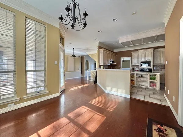 a living room with stainless steel appliances kitchen island granite countertop furniture and a kitchen view