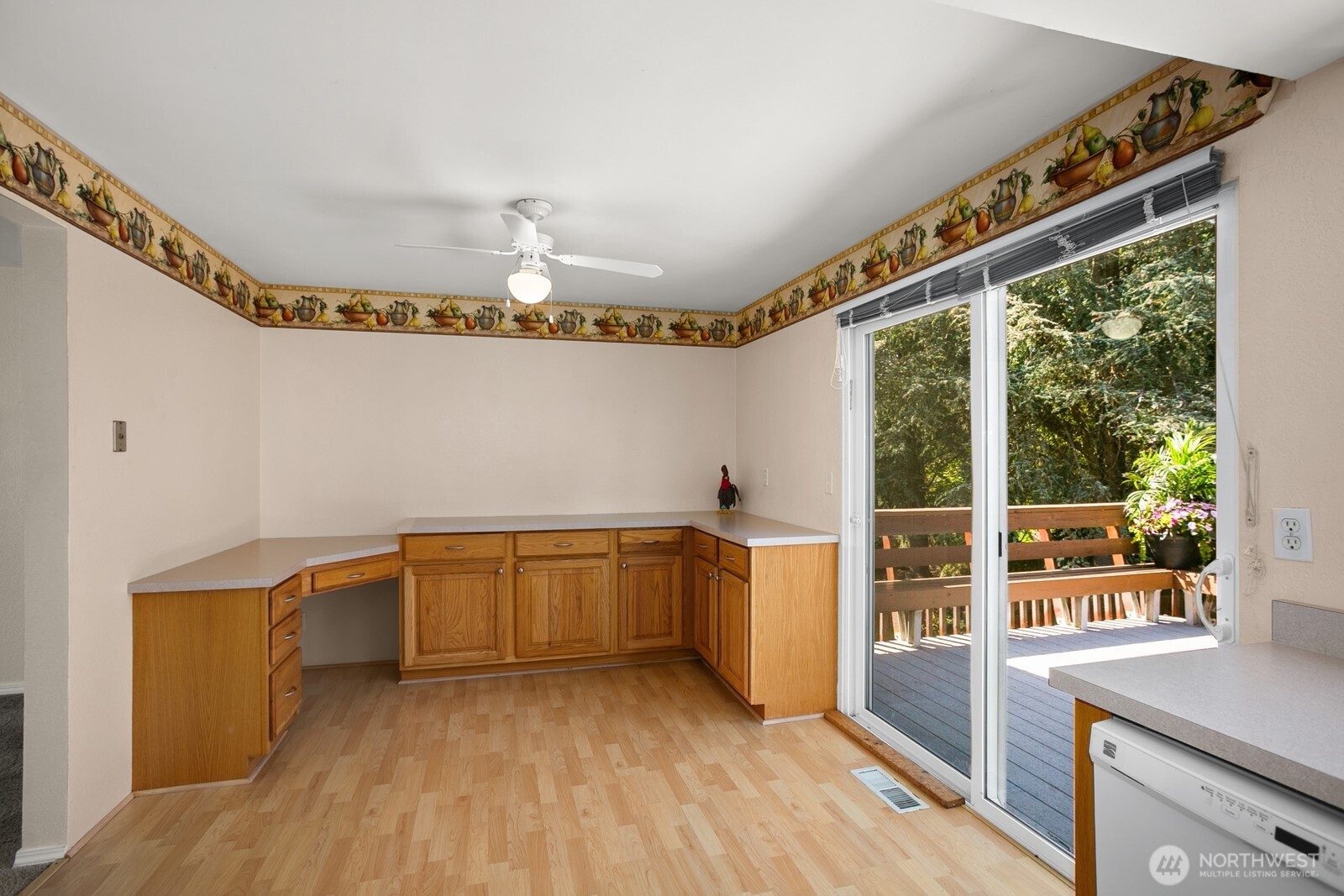 4206 Southeast 1st Place Renton, WA 98059 - Photo 8 of 25 a kitchen with sink cabinets and wooden floor