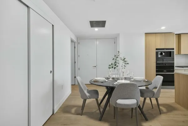 a spacious bedroom with a bed and a large window