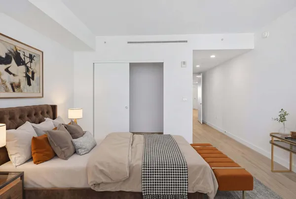 a view of a room with wooden floor