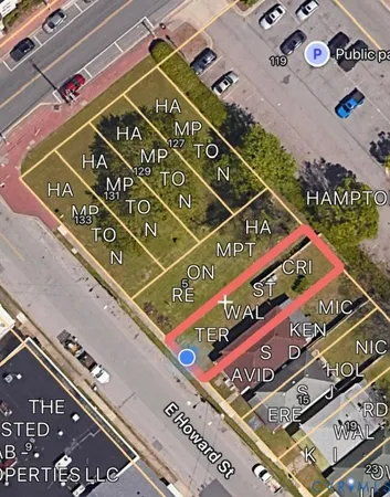 a view of a street with a building in the background