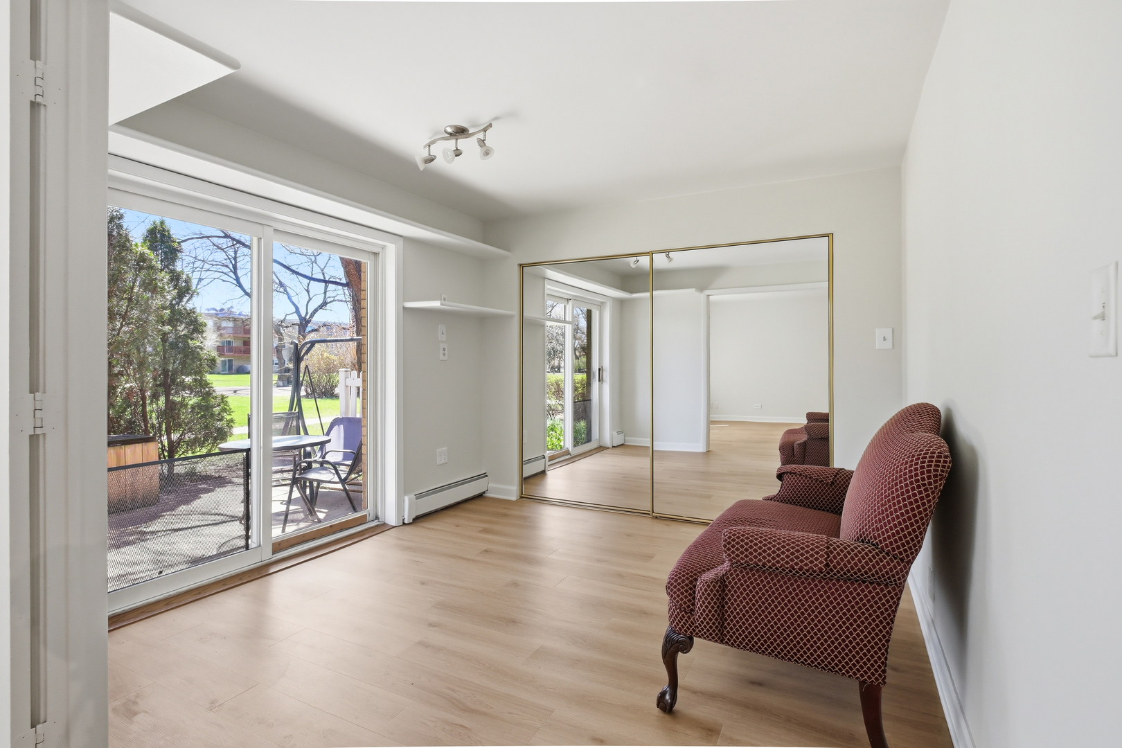 750 Dempster Street, Unit CG4 Mount Prospect, IL 60056 - Photo 7 of 20 a living room with furniture and a floor to ceiling window