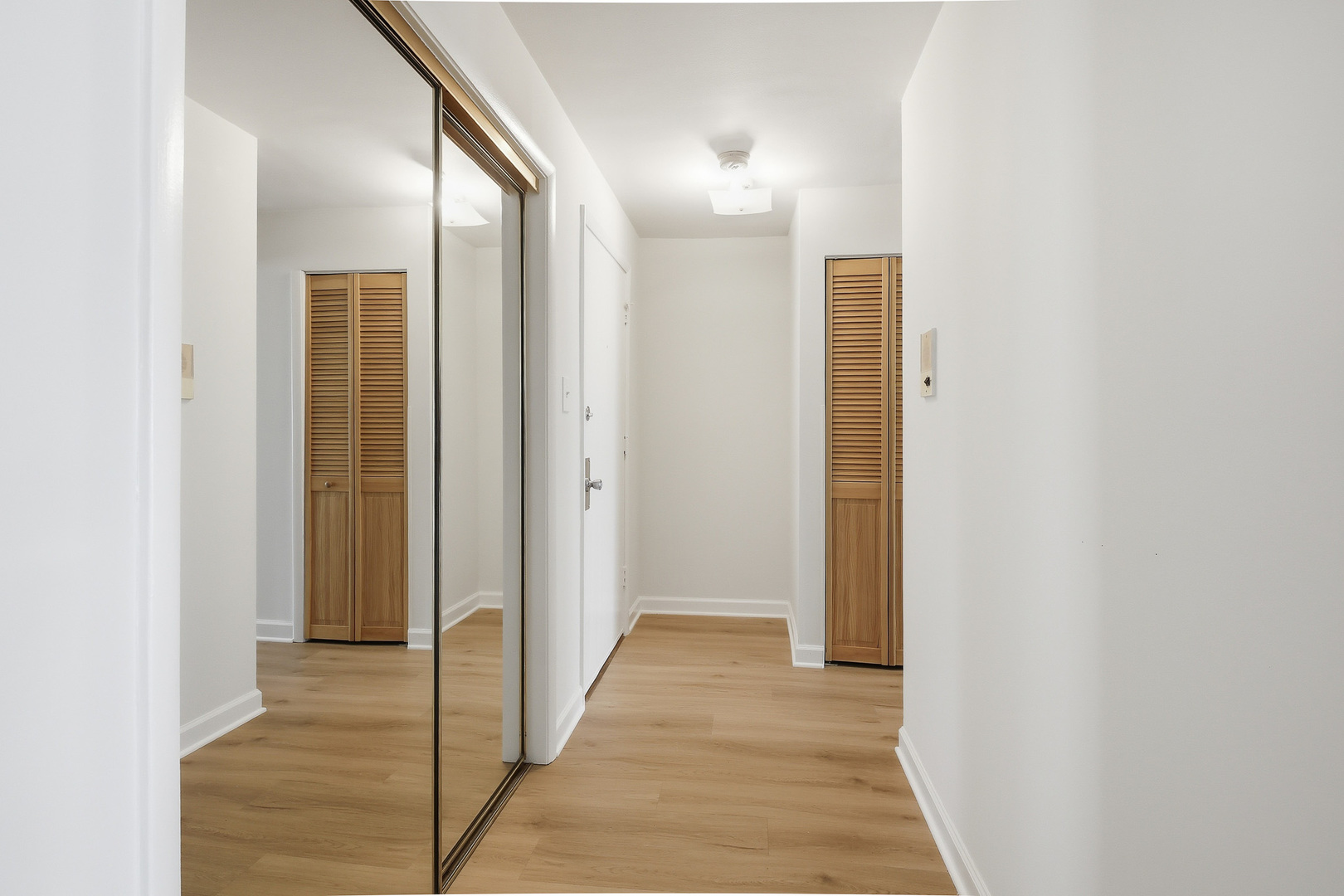 750 Dempster Street, Unit CG4 Mount Prospect, IL 60056 - Photo 8 of 20 a view of a hallway with wooden floor