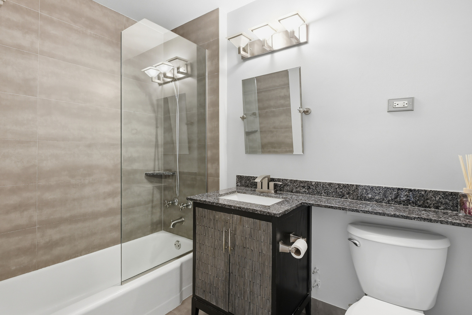 750 Dempster Street, Unit CG4 Mount Prospect, IL 60056 - Photo 9 of 20 a bathroom with a granite countertop sink toilet and shower