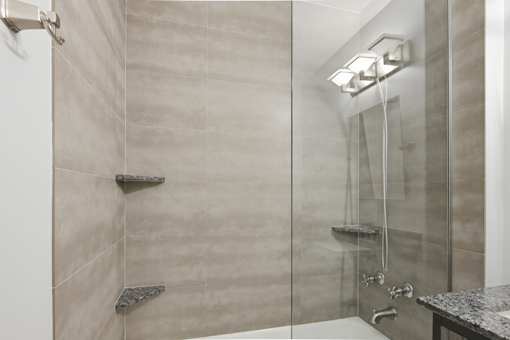 750 Dempster Street, Unit CG4 Mount Prospect, IL 60056 - Photo 10 of 20 a bathroom with a granite countertop shower a toilet and a sink