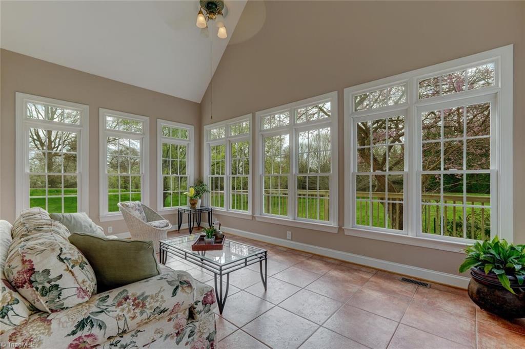 320 Spring Creek Road Summerfield, NC 27358 - Photo 8 of 34 Sunroom overlooking expansive backyard