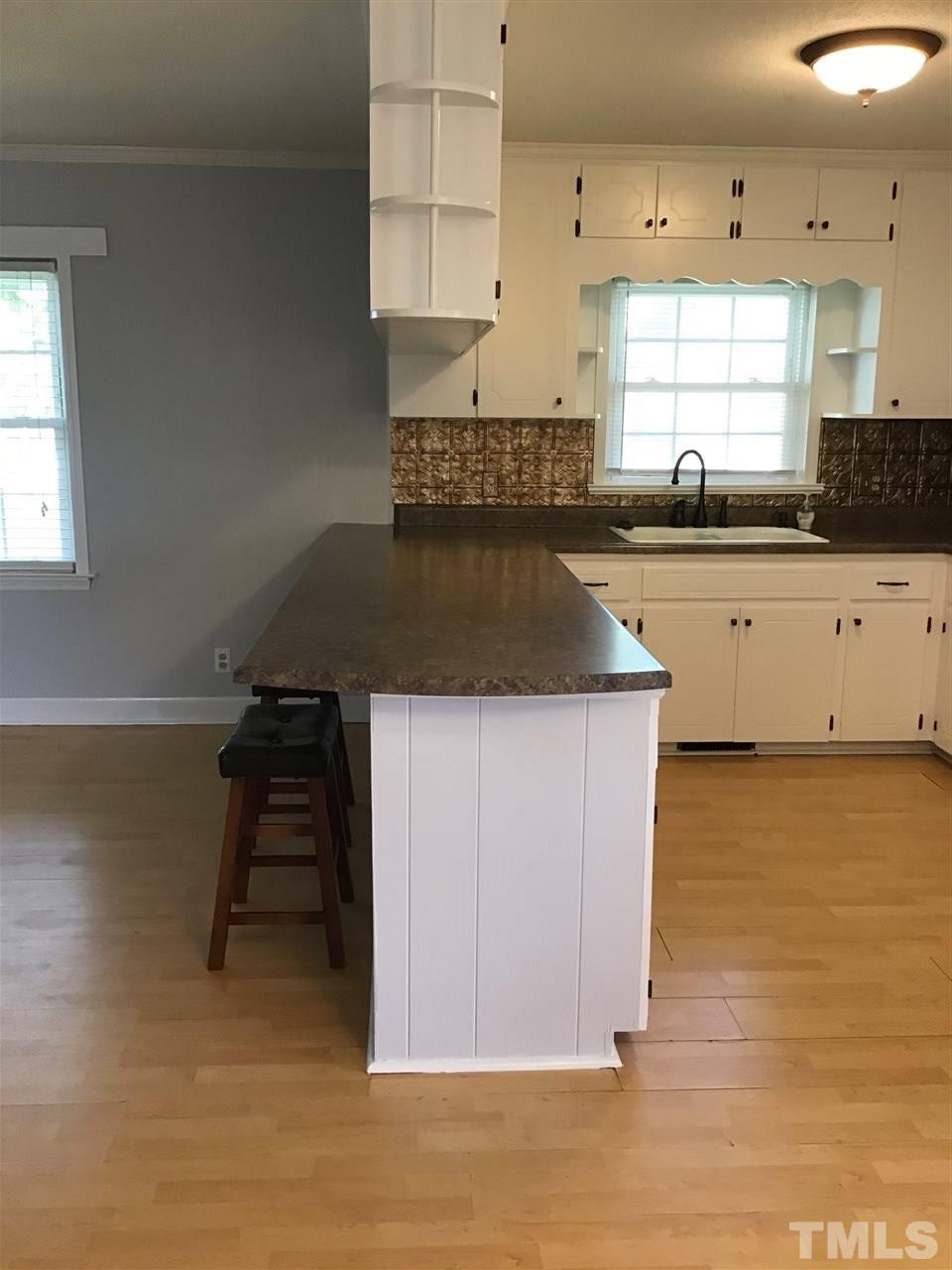 7103 Timothy Road Dunn, NC 28334 - Photo 22 of 30 Counter top has room for bar. Freshly painted walls, trim & shelves.