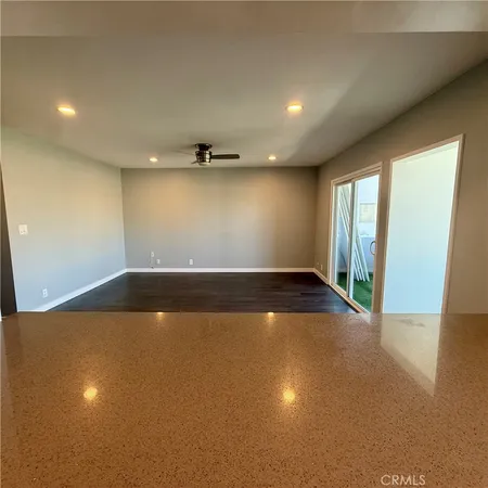 a kitchen with stainless steel appliances a refrigerator sink and microwave