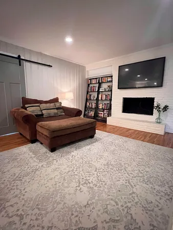 a living room with a couch and a flat screen tv