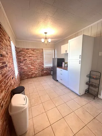 a bathroom with a sink a toilet and a shower
