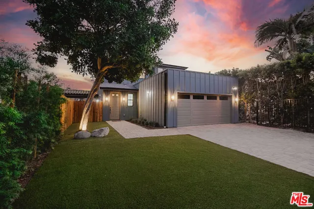 a view of a backyard of the house