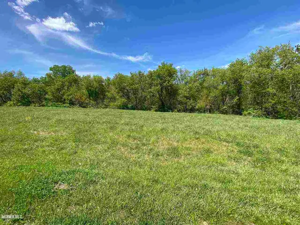 a view of a big yard with a garden
