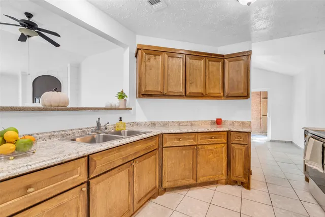 a kitchen with a sink cabinets and appliances