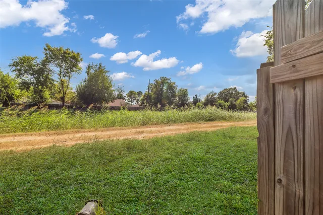 a view of outdoor space with garden and trees