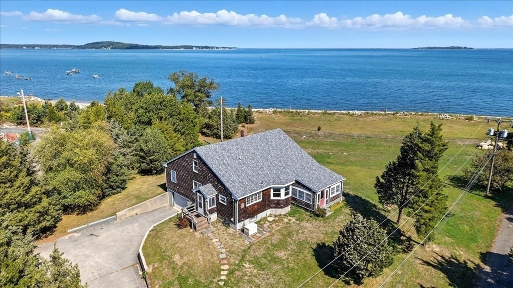 70 Hedge Road Plymouth, MA 02360 - Photo 1 of 41 a view of a lake with a mountain in the background